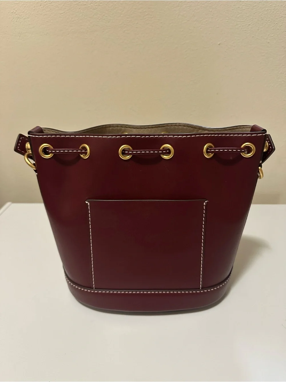 Tory Burch Leather Drawstring Bucket Bag with Gold Hardware in Huckleberry Color